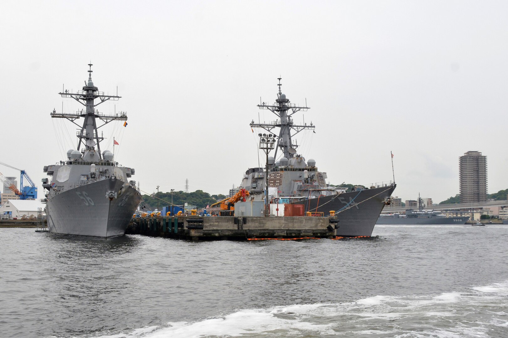 The Arleigh-Burke-class guided-missile destroyers USS John S. McCain (DDG 56) and USS Curtis Wilbur (DDG 54) sit pier-side at Fleet Activities (FLEACT) Yokosuka, May 16, 2017. FLEACT Yokosuka provides, maintains, and operates base facilities and services in support of 7th Fleet's forward-deployed naval forces, 71 tenant commands, and 26,000 military and civilian personnel. 