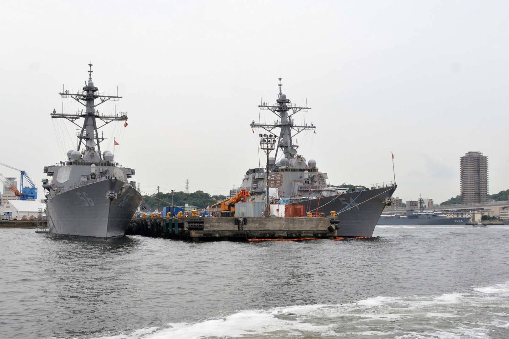 The Arleigh-Burke-class guided-missile destroyers USS John S. McCain (DDG 56) and USS Curtis Wilbur (DDG 54) sit pier-side at Fleet Activities (FLEACT) Yokosuka, May 16, 2017. FLEACT Yokosuka provides, maintains, and operates base facilities and services in support of 7th Fleet's forward-deployed naval forces, 71 tenant commands, and 26,000 military and civilian personnel. 