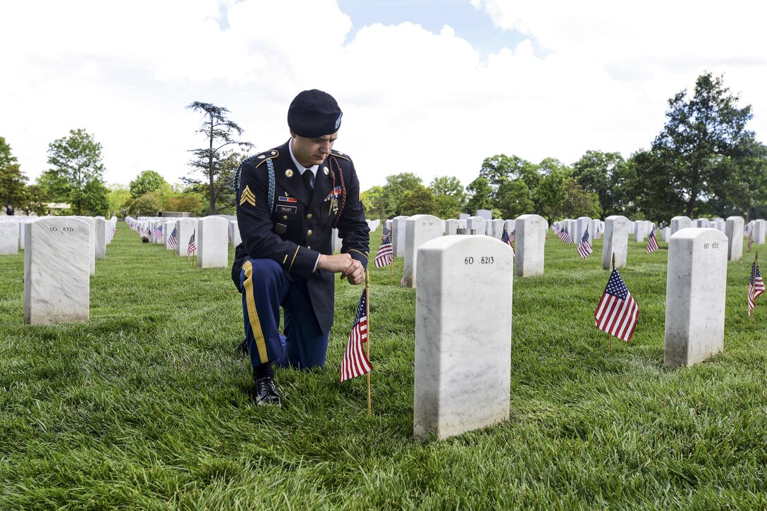 Army Sgt. Daniel Trust pays respects to his close friend, Army Capt. Jeremy A. Chandler