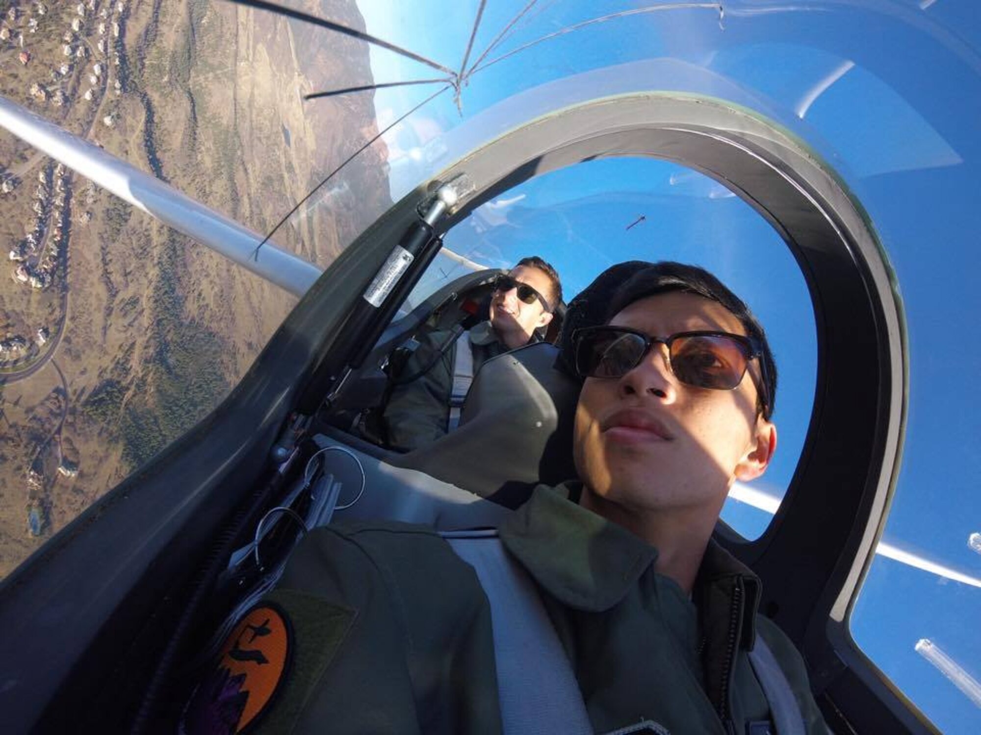 Cadet 2nd Class Alexander Hill pilots a glider over Colorado Springs. He and Cadet 2nd Class Alexander Hill are scheduled to spend their summer internship with Richard Petty Motorsports in Mooresville, North Carolina, researching ways to improve the team's NASCAR racecar. (U.S. Air Force photo)
