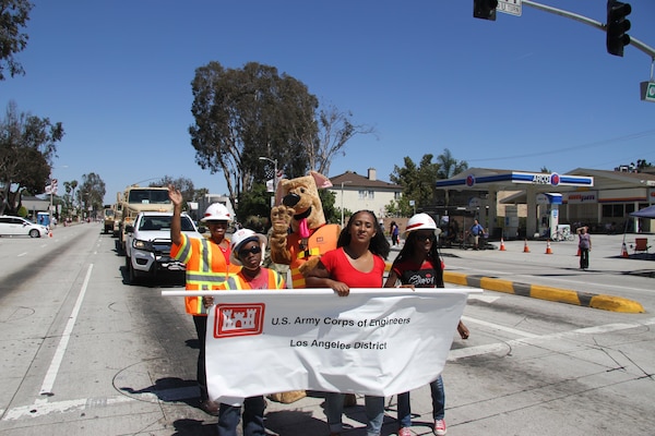 Delfina Fallin, a field office assistant with the U.S. Army Corps of Engineers The Los Angeles District's Fort Irwin Resident Engineer Office accompanied by her family assist "Bobber" as the participated in the City of Torrance’s 58th Annual Armed Forces Day parade here May 20.

The parade is an official Department of Defense event and is the city's way of expressing respect and reverence for the personnel who served in the armed forces, according to the city's website.

The city honored the men and women of our nation's military with a three-day celebration that began on Friday, May 19, and continued through Sunday, May 21.  The parade highlighted this year's honored branch, the United States Air Force.  
