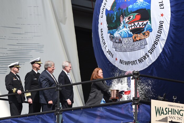 NEWPORT NEWS, Va. (March. 5, 2016) Secretary of the Navy (SECNAV) Ray Mabus looks on as Elisabeth Mabus, his daughter and ship's sponsor, christens the Navy's newest Virginia-class attack submarine, the future USS Washington (SSN 787) in Newport News, Va.