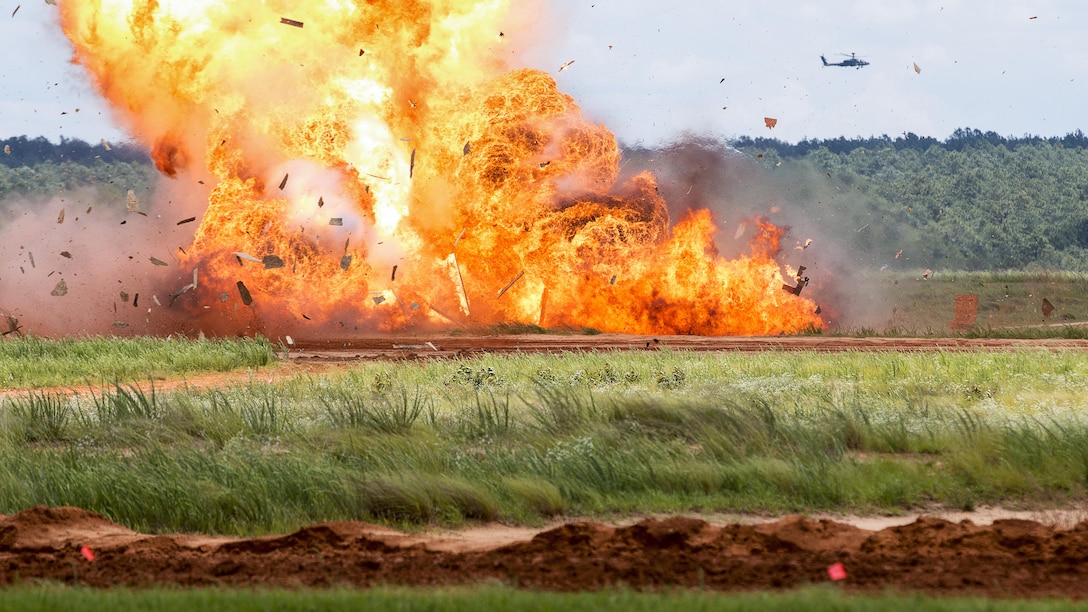 Paratroopers assigned to the 82nd Airborne Division detonate explosives during an airborne review at Fort Bragg, N.C., May 25, 2017. The review was the culminating event for All American Week, which celebrates the division. Army photo by Spc. Dustin D. Biven