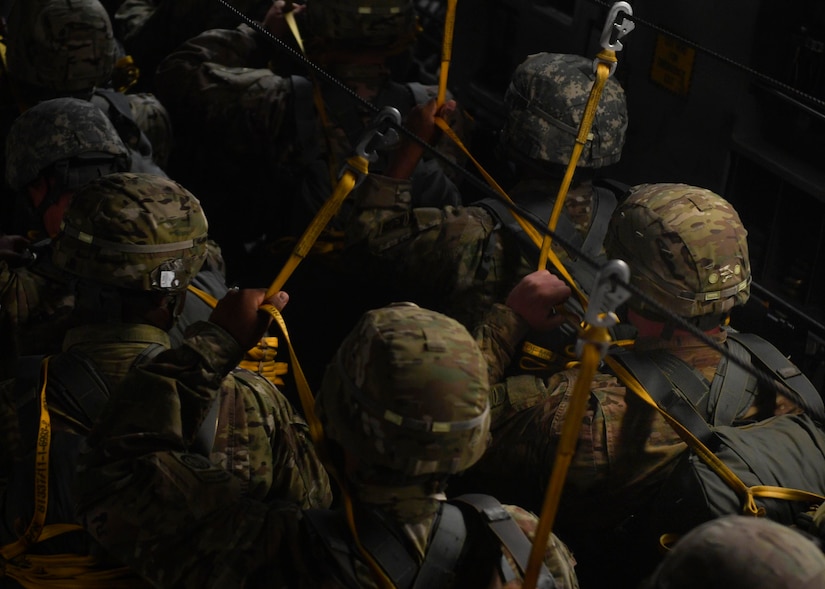 Soldiers from the 82nd Airborne Division prepare to jump from a C-17 Globemaster III above Fort Bragg, North Carolina, May 25, 2017. Nearly 1,600 soldiers were scheduled to jump during the exercise before high winds forced a cancellation of the jump for safety. 