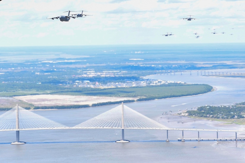 A formation of C-17 Globemaster IIIs fly over the Arthur Ravenel Jr. Bridge in Charleston, S.C., during a Large Formation Exercise, May 25, 2017. The LFE tested the 437th and 315th AW’s abilities to complete a joint forcible entry airdrop with the 82nd Airborne Division from Pope Army Airfield, culminating Exercise Bonny Jack 2017, a three-part mobility exercise.