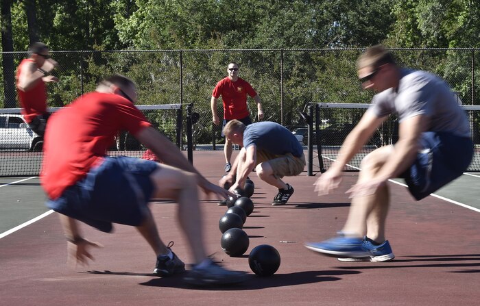 Airmen of the 437th Aircraft Maintenance Squadron and the 16th Airlift Squadron compete during a dodge ball game as part of the 437th Airlift Wing picnic at Joint Base Charleston, S.C., May 26. Attendees were able to compete in sports and play games during the event such as basketball, dodge ball, tug-of-war and ultimate Frisbee. (U.S. Air Force photo by Staff Sgt. Christopher Hubenthal)