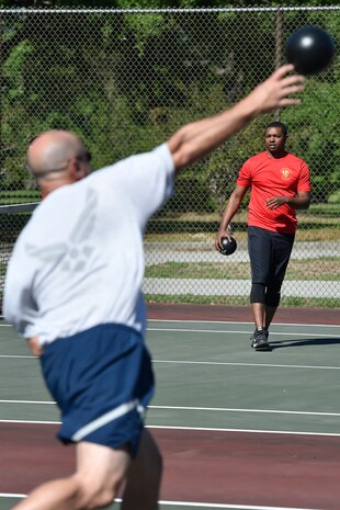 Senior Airman Anthony Gilliam, 16th Airlift Squadron, plays dodge ball with Airmen of the 437th Aircraft Maintenance Squadron as part of the 437th Airlift Wing picnic at Joint Base Charleston, S.C., May 26. Attendees were able to compete in sports and play games during the event such as basketball, dodge ball, tug-of-war and ultimate Frisbee. (U.S. Air Force photo by Staff Sgt. Christopher Hubenthal)