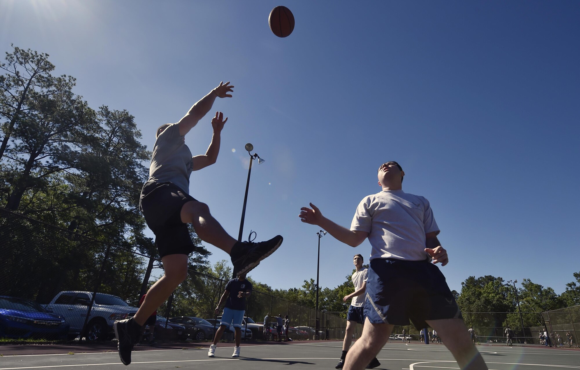 Staff Sgt. Shawn Montgomery, 437th Maintenance Squadron, takes a shot during a basketball game against Airmen of the 437th Aircraft Maintenance Squadron as part of the 437th Airlift Wing picnic at Joint Base Charleston, S.C., May 26. Attendees were able to compete in sports and play games during the event such as basketball, dodge ball, tug-of-war and ultimate Frisbee. (U.S. Air Force photo by Staff Sgt. Christopher Hubenthal)