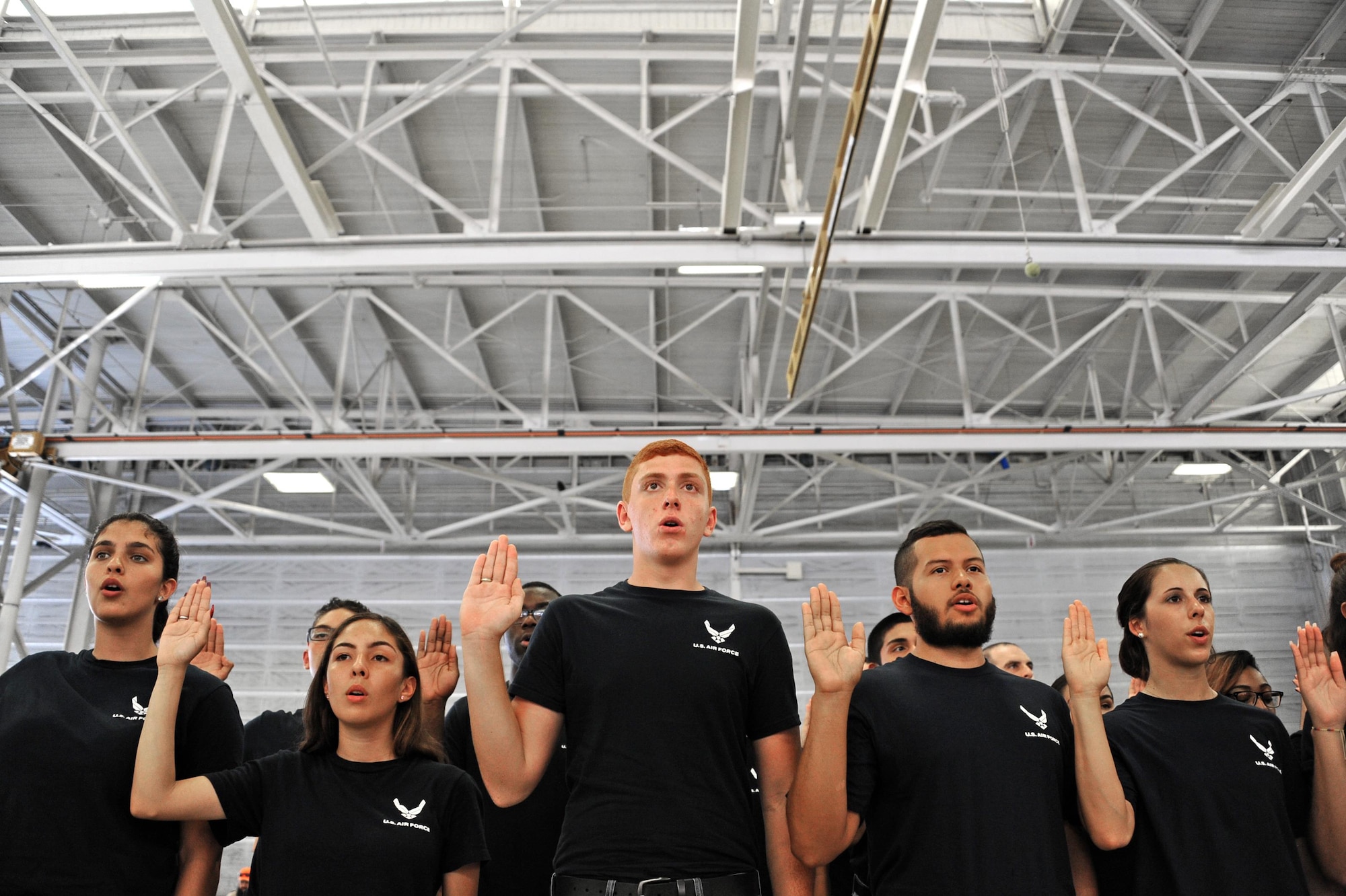 Air Force Delayed Entry Program recruits are sworn in during a U.S. Armed Services swear-in ceremony during the Memorial Day weekend National Salute to America’s Heroes Miami Air and Sea Show at U.S. Coast Guard Air Station Miami in Opa-Locka, Fla., May 26, 2017. Department of Defense service members, DEP family members, and guests witnessed approximately 97 Air Force recruits took the Oath of Enlistment, along with Army, Navy, Marine Corps, and Coast Guard recruits. (U.S. Air Force photo by Senior Airman Erin Trower)