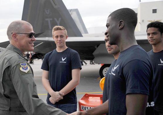 Air Force Maj. Gen. Thomas Bussiere, Eighth Air Force commander, meets Delayed Entry Program Air Force recruits during the Memorial Day weekend National Salute to America’s Heroes Miami Air and Sea Show at U.S. Coast Guard Air Station Miami in Opa-Locka, Fla., May 26, 2017. Department of Defense service members, DEP family members, and guests witnessed approximately 97 Air Force recruits took the Oath of Enlistment, along with Army, Navy, Marine Corps, and Coast Guard recruits. (U.S. Air Force photo by Senior Airman Erin Trower)