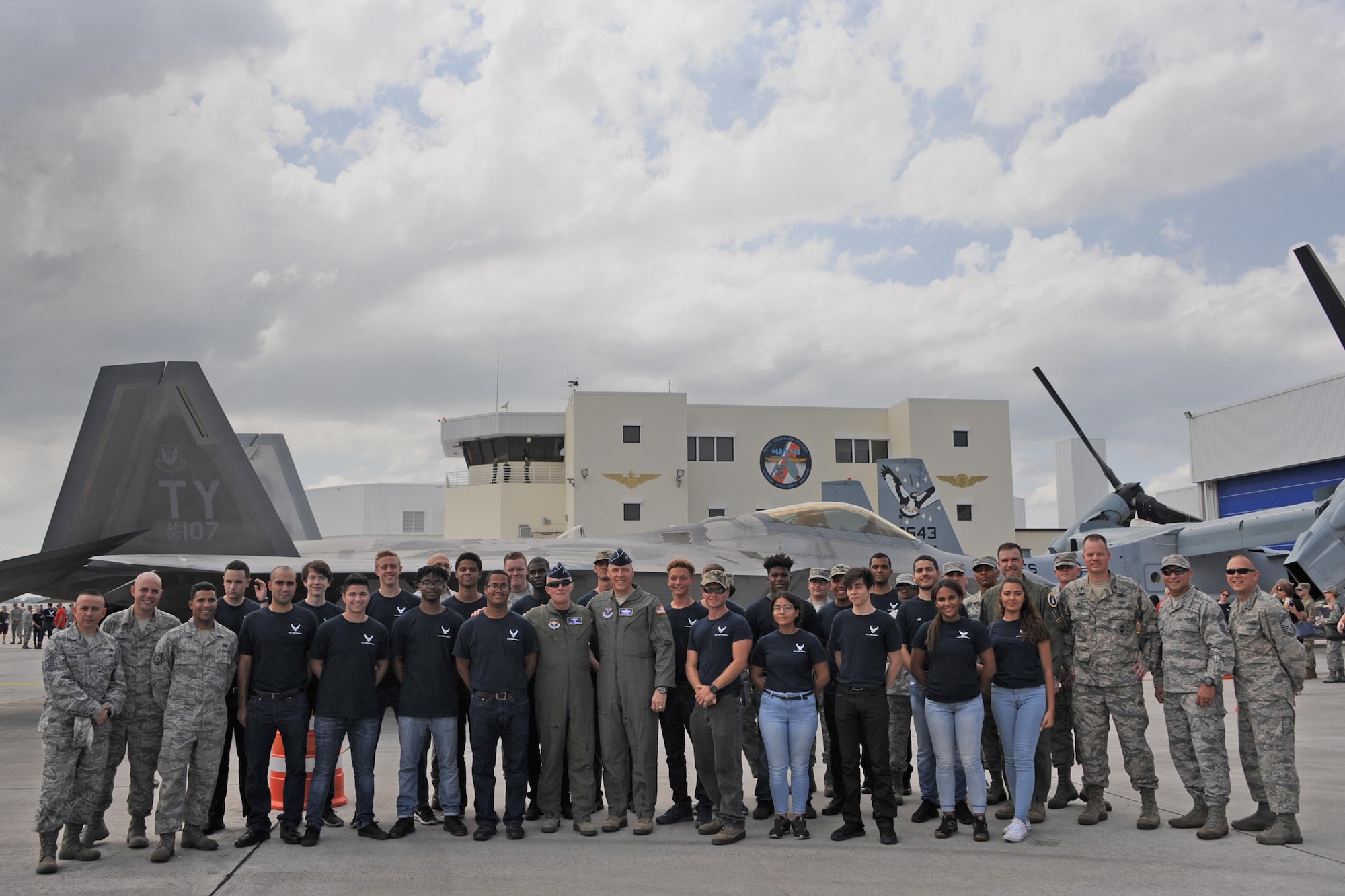 Air Force Maj. Gen. Garrett Harencak, Air Force Recruiting Service commander, stands with Air Force Maj. Gen. Thomas Bussiere, Eighth Air Force commander, both center, during the Memorial Day weekend National Salute to America’s Heroes Miami Air and Sea Show at U.S. Coast Guard Air Station Miami in Opa-Locka, Fla., May 26, 2017. The joint-service event allows the five branches of the U.S. Armed Forces to demonstrate and educate the public on their asset’s capabilities, and increases awareness and understanding of each branch’s unique mission. (U.S. Air Force photo by Senior Airman Erin Trower)