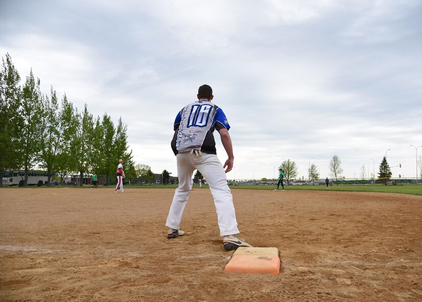 A Grand Forks AFB Airman anxiously awaits the next pitch at the annual Grand Forks AFB versus Minot AFB softball tournament May 25, 2017, at Devil’s Lake, N.D. Grand Forks had a great turnout of volunteer players, all of whom were excited to play alongside their fellow Airmen. (U.S. Air Force photo by Airman 1st Class Elora McCutcheon)
