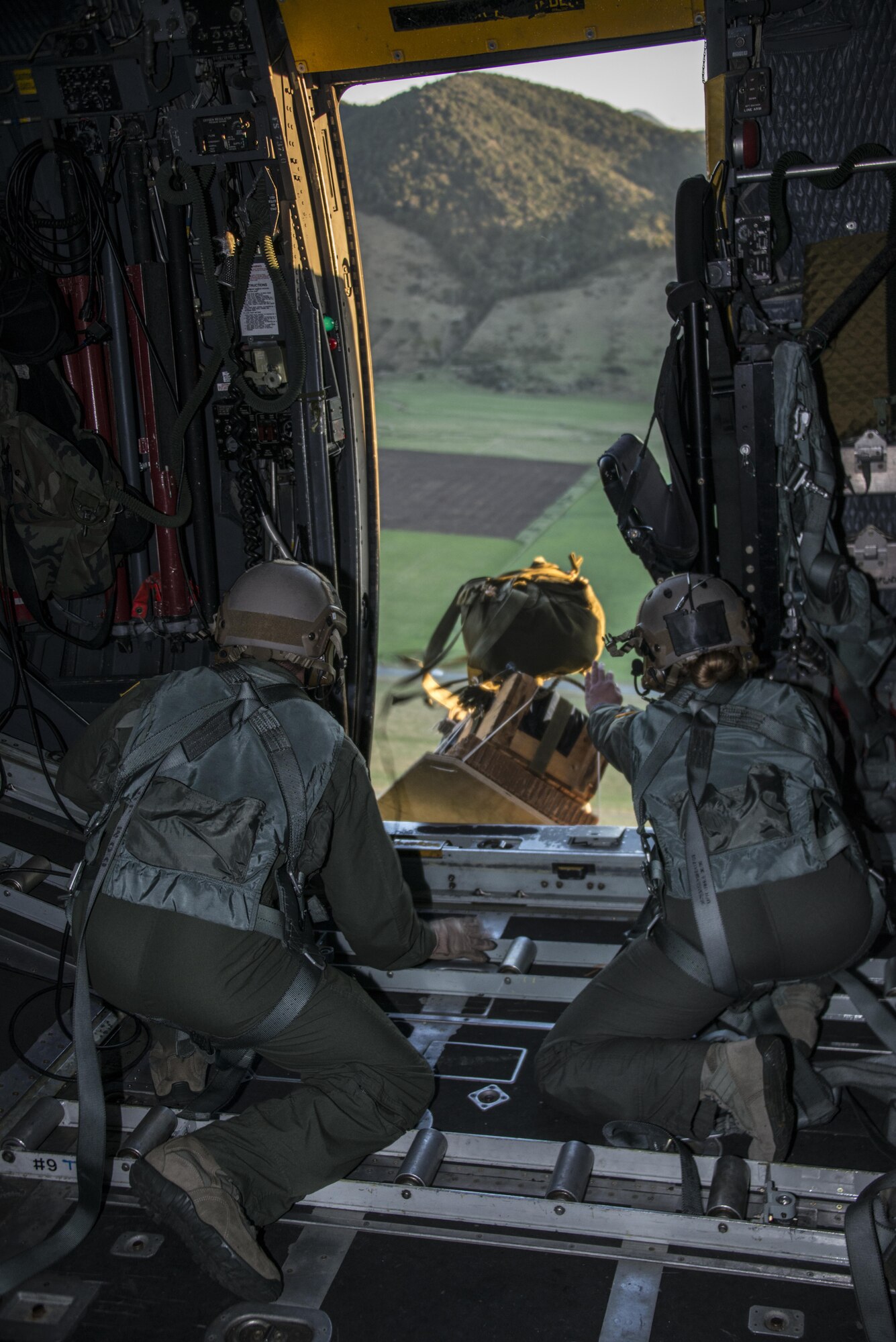 A U.S. Air Force 1st Special Operations Squadron loadmaster and Special Operations Forces Medical Element (SOFME) medic assigned to the 353rd Special Operations Support Squadron push a bundle out the side door of a U.S. Air Force MC-130H Combat Talon II during airdrop training, April 22, 2017 at Royal New Zealand Air Force Base Woodbourne, New Zealand. The 1st SOS exchanged the best techniques and procedures with RNZAF 40th Squadron during Exercise Teak Net. (U.S. Air Force photo by Capt. Jessica Tait)