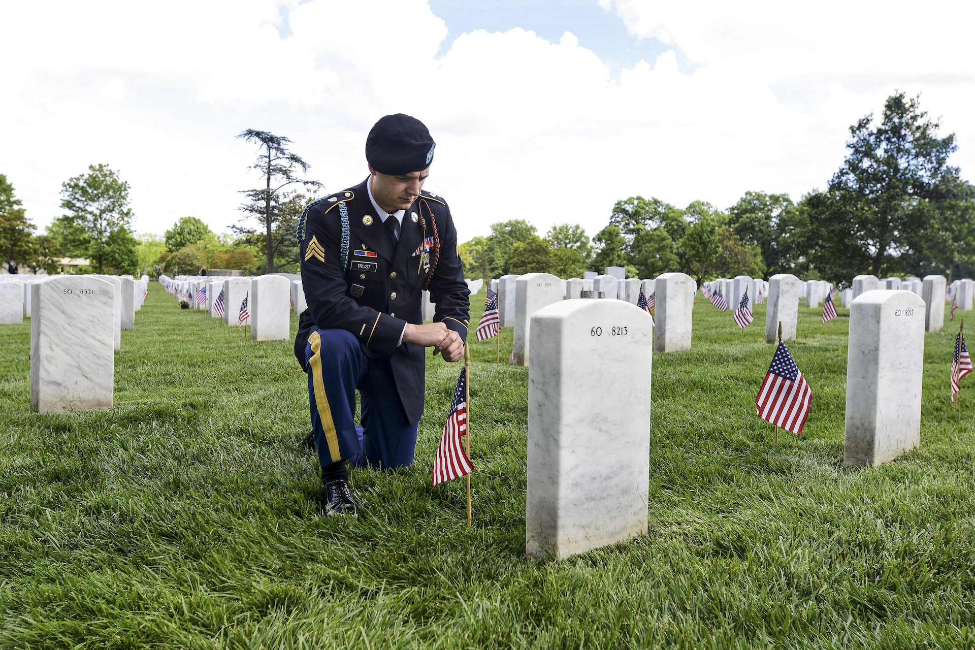 Army Sgt. Daniel Trust pays respects to his close friend, Army Capt. Jeremy A. Chandler, who was killed in action during Operation Enduring Freedom during  the Flags In ceremony at Arlington National Cemetery in Arlington, Va., May 25, 2017. DoD photo by Sebastian J. Sciotti Jr.

