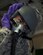 U.S. Air Force Airman 1st Class Dallas Galvan, an aircrew flight equipment technician with the 379th Expeditionary Operational Support Squadron, buckles the MBU-20/P mask into the HGU-55/P helmet at Al Udeid Air Base, Qatar, May 16, 2017. Galvan is preforming an inspection that checks the working order of the microphone, head set and oxygen is flowing by plugging the MBU-20/P mask into a tester that simulates aircraft functions and air pressure. (U.S. Air Force photo by Tech. Sgt. Amy M. Lovgren)
