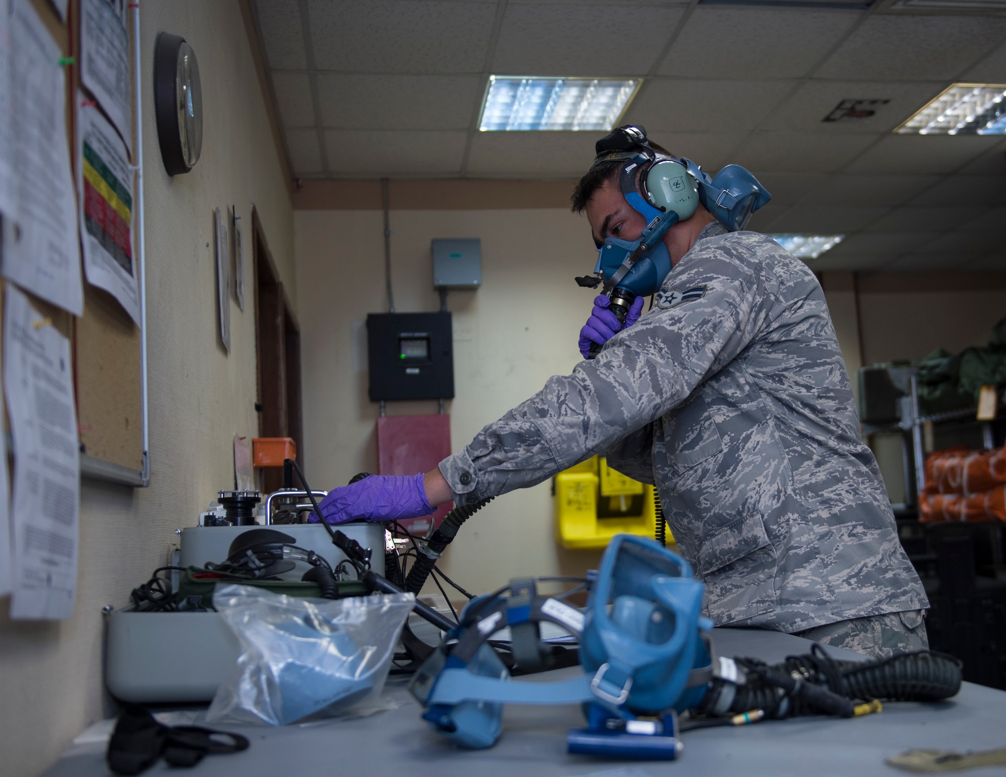 U.S. Air Force Airman 1st Class Dallas Galvan, an aircrew flight equipment technician with the 379th Expeditionary Operational Support Squadron, tests the Scott 358 Quick Don Oxygen Mask at Al Udeid Air Base, Qatar May 16, 2017. Galvan is preforming an inspection where he plugs the Scot 358 Quick Don Oxygen Mask into the Scot Tester which simulates aircraft functions and air pressure. (U.S. Air Force photo by Tech. Sgt. Amy M. Lovgren)