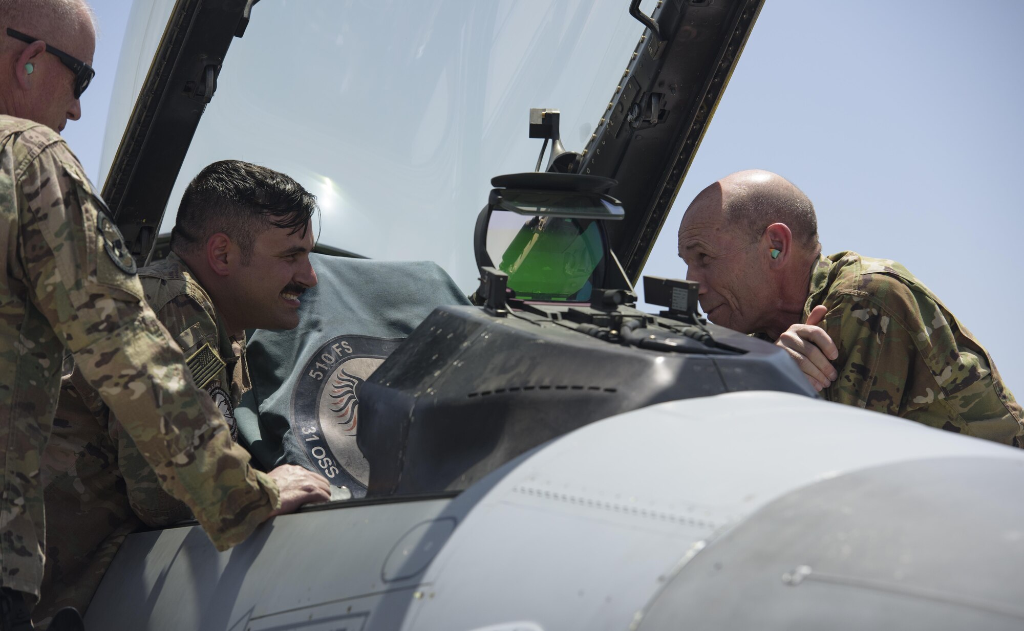 Senior Airman Christopher Caruso, 455th Expeditionary Aircraft Maintenance Squadron, speaks with Gen. Mike Holmes, commander of Air Combat Command, about the capabilities of the F-16 Fighting Falcon at Bagram Airfield, Afghanistan, May 25, 2017. Holmes commanded the 455th Air Expeditionary Wing from March 2008 to April 2009. (U.S. Air Force photo by Staff Sgt. Benjamin Gonsier)