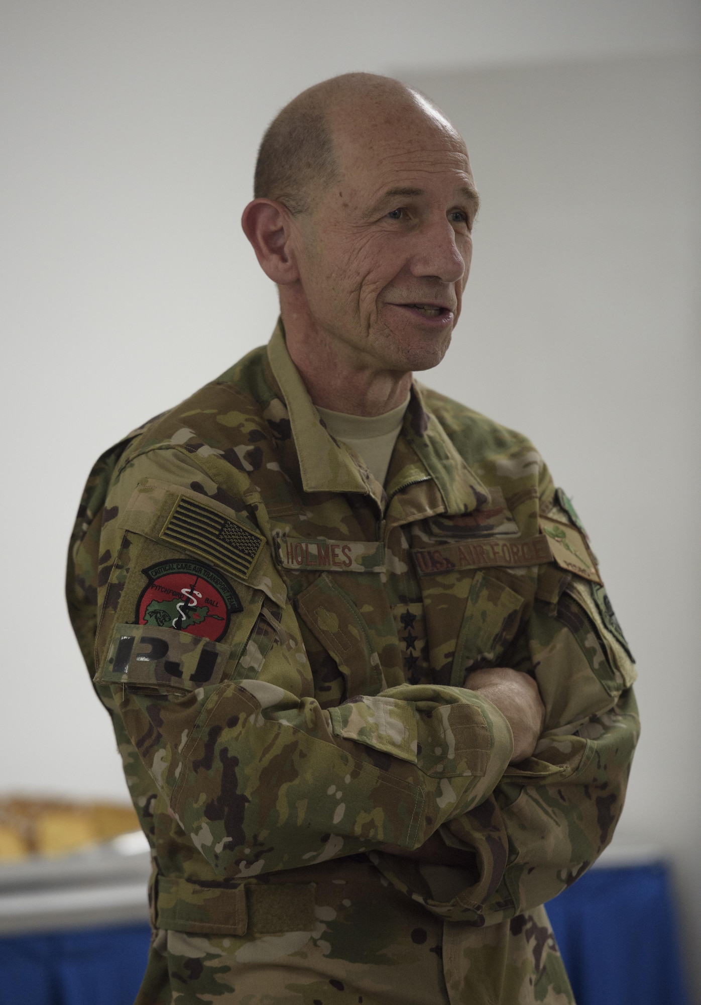 Gen. Mike Holmes, who commanded the 455th Air Expeditionary Wing from March 2008 to April 2009, visited Bagram Airfield, Afghanistan, May 25, 2017. During his visit, Holmes met with Airmen and Soldiers to discuss their role in the Afghanistan theater of operations and how their projection of airpower help make the country better. The units he visited presented him their organizational patch, which he proudly placed on his Occupational Camouflage Pattern uniform in appreciation to their kind gesture. (U.S. Air Force photo by Staff Sgt. Benjamin Gonsier)