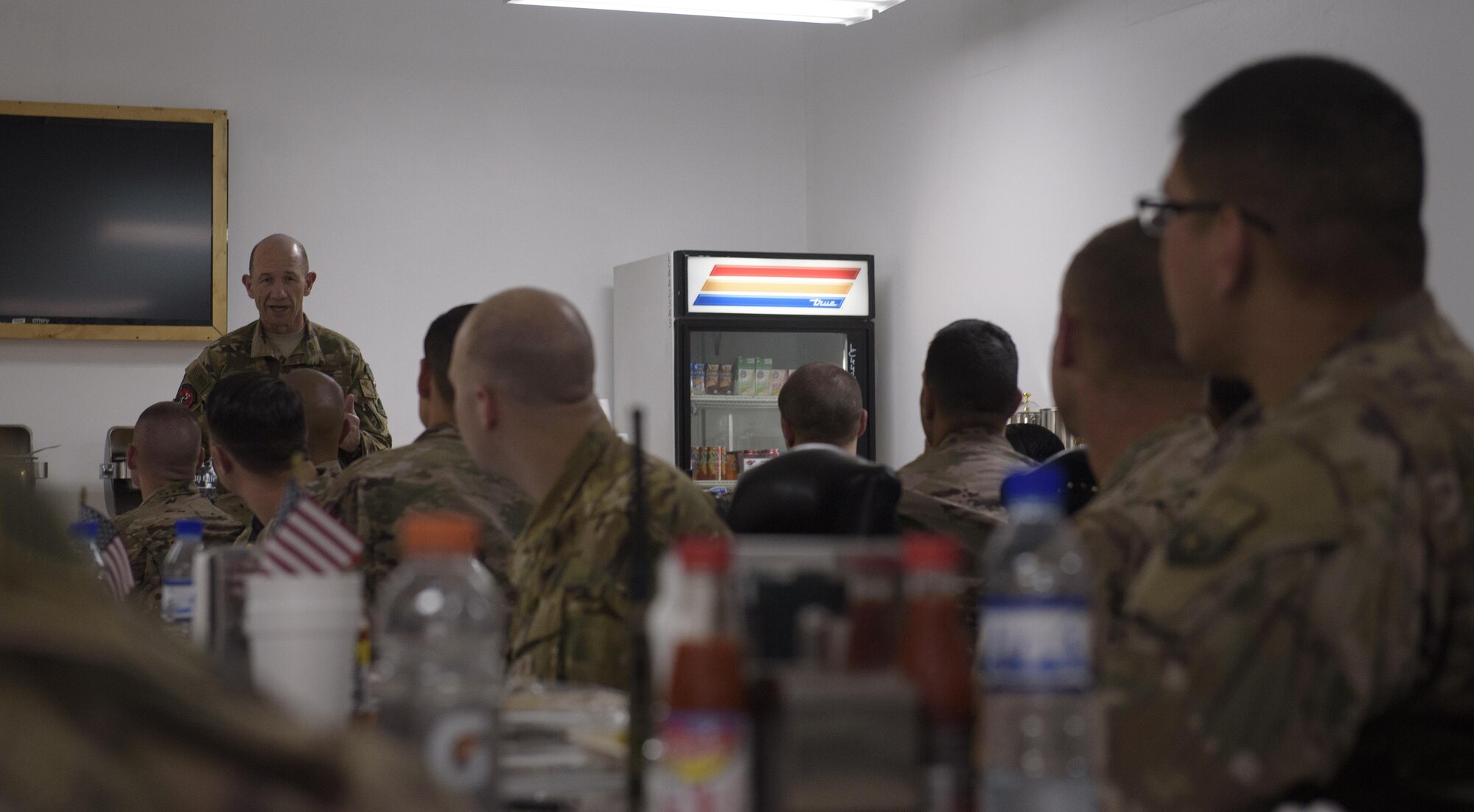 Gen. Mike Holmes, commander of Air Combat Command, speaks with Airmen during a discussion on Air Force topics at Bagram Airfield, Afghanistan, May 25, 2017. Holmes met with Bagram Airmen to discuss their role in Afghanistan and share with them how it was during his time at the 455th Air Expeditionary Wing, where he served as the commander from March 2008 to April 2009. (U.S. Air Force photo by Staff Sgt. Benjamin Gonsier)