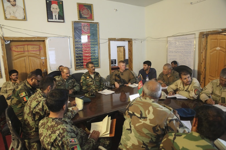 Afghan National Army soldiers with the 215th Corps and U.S. Marines with Task Force Southwest gather for an introductory meeting at Camp Nolay, Afghanistan, May 21, 2017. Marine advisors addressed force sustainment procedures and helped facilitate a clearing operation with their Afghan counterparts during an expeditionary advising package May 21-25. The EAP allowed for the Marines to bring their skills and knowledge to the 2nd Brigade, 215th Corps, helping to bolster security and stability in the Sangin District of Helmand Province. (U.S. Marine Corps photo by Sgt. Lucas Hopkins)