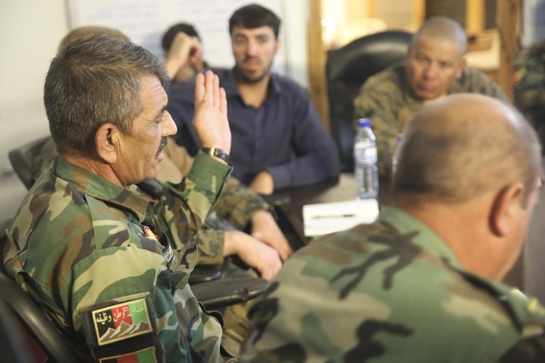Afghan National Army Col. Abdul Waheid Tamurei, the commanding officer of 2nd Brigade, 215th Corps, speaks to Afghan soldiers and U.S. Marines with Task Force Southwest at Camp Nolay, Afghanistan, May 21, 2017. Marine advisors travelled to the Sangin District of Helmand Province for an expeditionary advising package May 21-25, helping to coordinate a clearing operation as well as providing force sustainment support for the 2nd Brigade. (U.S. Marine Corps photo by Sgt. Lucas Hopkins)