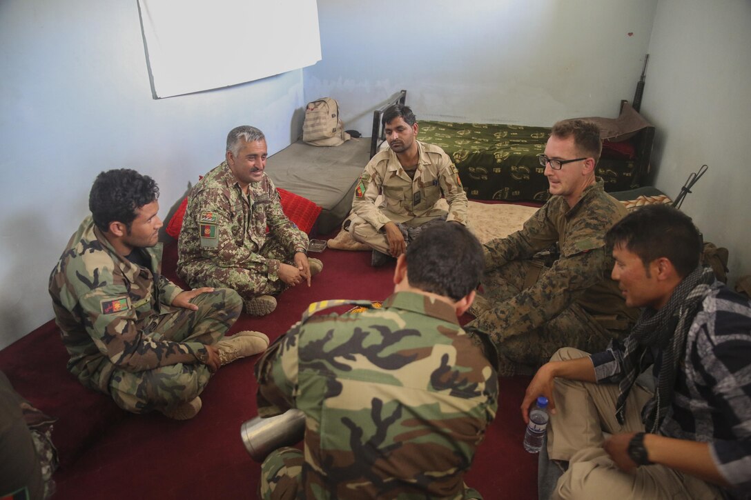 A U.S. Marine advisor with Task Force Southwest speaks to Afghan National Army soldiers with 2nd Brigade, 215th Corps on artillery capabilities at Camp Nolay, Afghanistan, May 22, 2017. Several advisors with the Task Force participated in an expeditionary advisory package, which focused on improving short and long-term force sustainment throughout the Brigade. Based in Camp Shorab, Afghanistan, Task Force Southwest travelled to the Sangin District to gain a better understanding of the 215th Corps’ subordinate units, while also facilitating a clearing operation conducted by the 3rd Kandak, 2nd Brigade. (U.S. Marine Corps photo by Sgt. Lucas Hopkins)