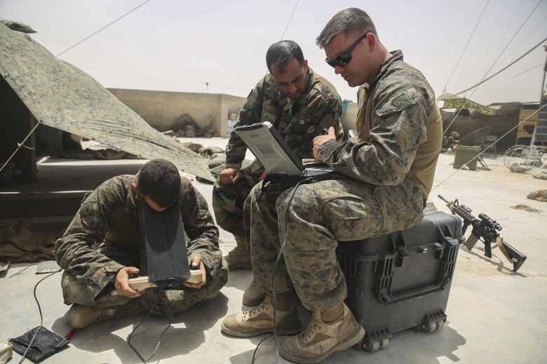 U.S. Marines with Task Force Southwest and an Afghan National Army soldier with 2nd Brigade, 215th Corps monitor a Raven unmanned aerial system at Camp Nolay, Afghanistan, May 23, 2017. Approximately 10 advisors with the Task Force participated in an expeditionary advisory package, which focused on improving short and long-term force sustainment throughout the Brigade. Based in Camp Shorab, Afghanistan, Task Force Southwest travelled to the Sangin District to gain a better understanding of the 215th Corps’ subordinate units, while also facilitating a clearing operation conducted by the 3rd Kandak, 2nd Brigade. (U.S. Marine Corps photo by Sgt. Lucas Hopkins)