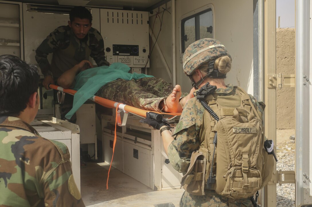 A U.S. Navy Sailor with Task Force Southwest and an Afghan National Army soldier with 2nd Brigade, 215th Corps prepare to evacuate a wounded ANA soldier at Camp Nolay, Afghanistan, May 23, 2017. Several Marine advisors assisted their Afghan counterparts with force sustainment improvements, as well as assisting in the coordination of a clearing operation to help thwart enemy presence in the Sangin District. (U.S. Marine Corps photo by Sgt. Lucas Hopkins)