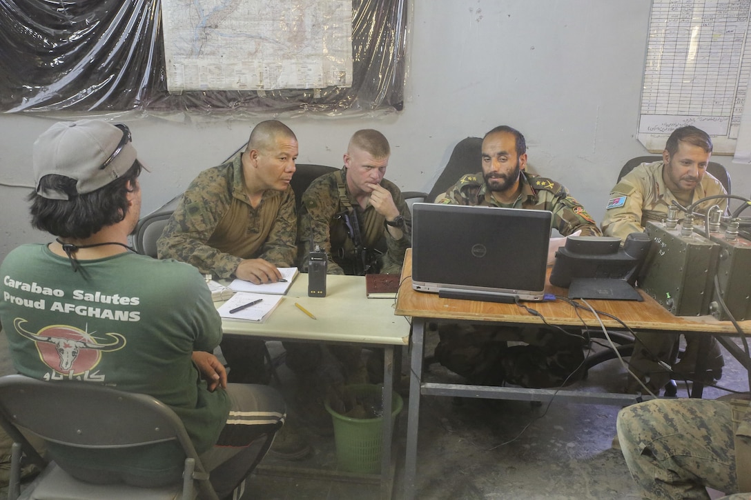 U.S. Marine advisors with Task Force Southwest and Afghan National Army soldiers with 2nd Brigade, 215th Corps monitor battlefield operations at the Brigade’s command operations center in Camp Nolay, Afghanistan, May 23, 2017. The advisors assisted their counterparts with the battle-tracking, intelligence and logistical procedures during a clearing operation in Sangin, Afghanistan. Approximately 50 Marines partook in the expeditionary advising package as part of the Task Force’s train, advise and assist mission in Helmand Province. (U.S. Marine Corps photo by Sgt. Lucas Hopkins)