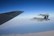 Two U.S. Navy F/A-18Cs from the Strike Fighter Squadron VFA-37 Ragin' Bulls fly in formation alongside a U.S. Air Force KC-135 Stratotanker during a combat refueling mission over Southwest Asia May 21, 2017.  KC-135 Stratotankers, from the 340th Expeditionary Air Refueling Squadron at Al Udeid Air Base, Qatar, maintain a 24/7 presence in the Area Of Responsibility, supporting U.S. and Coalition forces in the air and on the ground, contributing to Operation Inherent Resolve and the fight against ISIS. (U.S. Air National Guard photo by Master Sgt. Andrew J. Moseley/Released)