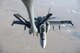 A U.S. Navy F/A-18C from the Strike Fighter Squadron VFA-37 Ragin' Bulls receives fuel in flight from a U.S. Air Force KC-135 Stratotanker over Southwest Asia May 21, 2017. Assigned to the 340th Expeditionary Air Refueling Squadron, out of Al Udeid Air Base, Qatar, the tanker from the 186th Air Refueling Wing, Mississippi Air National Guard was fitted with a drogue attached to the boom, for specialized receiver equipment on Navy and coalition aircraft. The 340th EARS maintains a 24/7 presence in the AOR, extending the missions of aircraft supporting Operation Inherent Resolve and the fight against ISIS. (U.S. Air National Guard photo by Master Sgt. Andrew J. Moseley/Released)