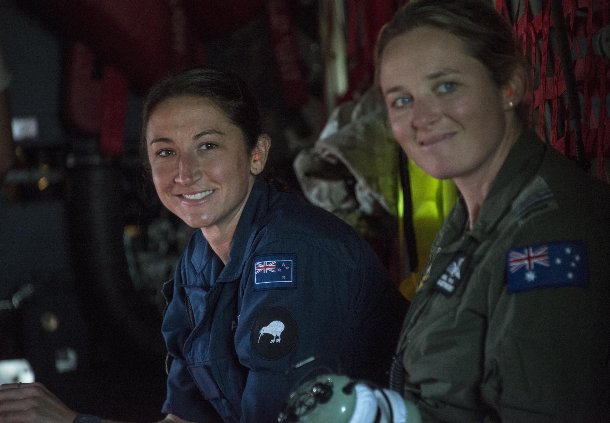 A Royal New Zealand Air Force logistics officer and Royal Australian Air Force exchange pilot sit in the back of a U.S. Air Force MC-130H Combat Talon II assigned to the 1st Special Operations Squadron during a combined formation flight, April 22, 2017 at RNZAF Base Woodbourne, New Zealand. The combined mission demonstrated the strength of the alliance between the United States and New Zealand (U.S. Air Force photo by Capt. Jessica Tait)