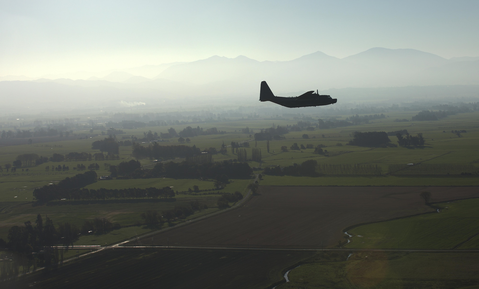 A U.S. Air Force 1st Special Operations Squadron MC-130H Combat Talon II flies in formation with a Royal New Zealand Air Force 40th Squadron C-130, April 22, 2017 at RNZAF Base Woodbourne, New Zealand. Executing airborne operations throughout Exercise Teak Net, the formation flight symbolized the strength of a partnership that has evolved over the years. (U.S. Air Force courtesy photo by Capt. Kevin Knutson)