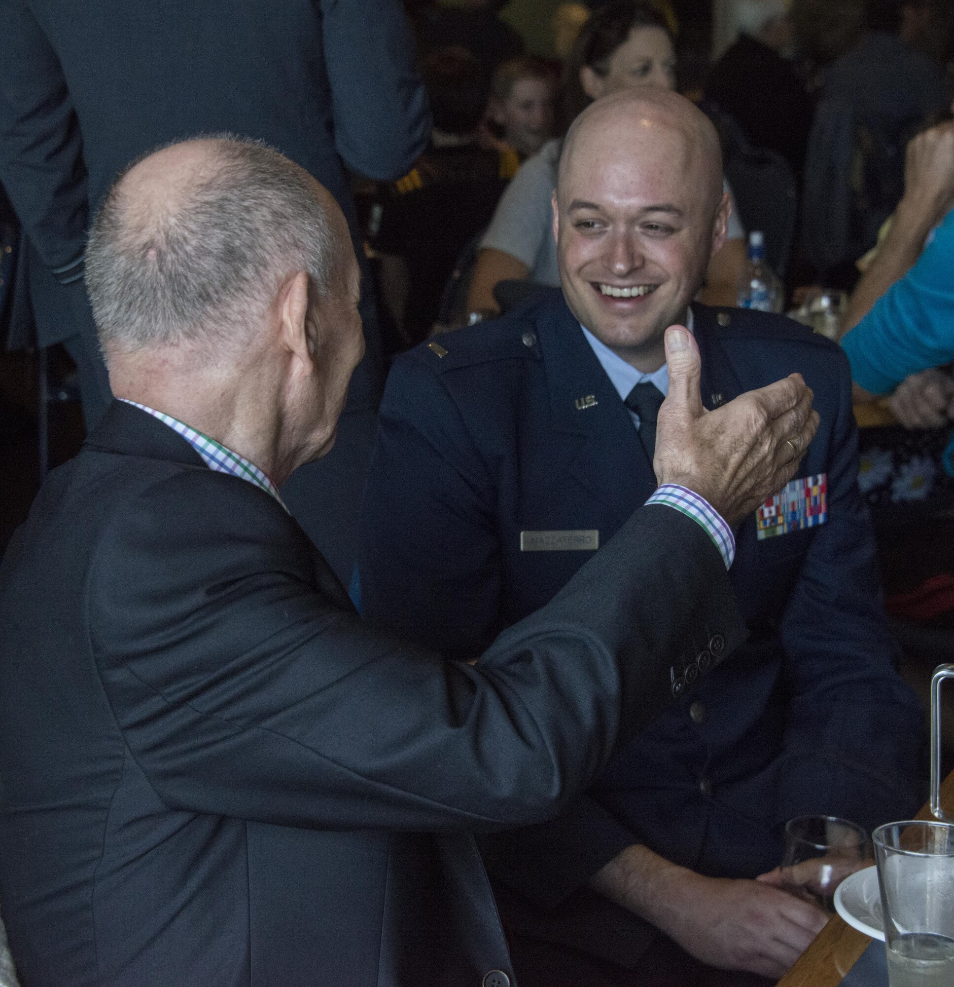 A U.S. Air Force 1st Special Operations Squadron electronic warfare officer engages with a local New Zealander following the ceremonial portion of the ANZAC Day event, April 25, 2017 in Blenheim, New Zealand. The Airmen commemorated with Royal New Zealand Air Force partners during ANZAC Day, as this year marks the 100-year anniversary of U.S. participation in WWI. (U.S. Air Force photo by Capt. Jessica Tait)