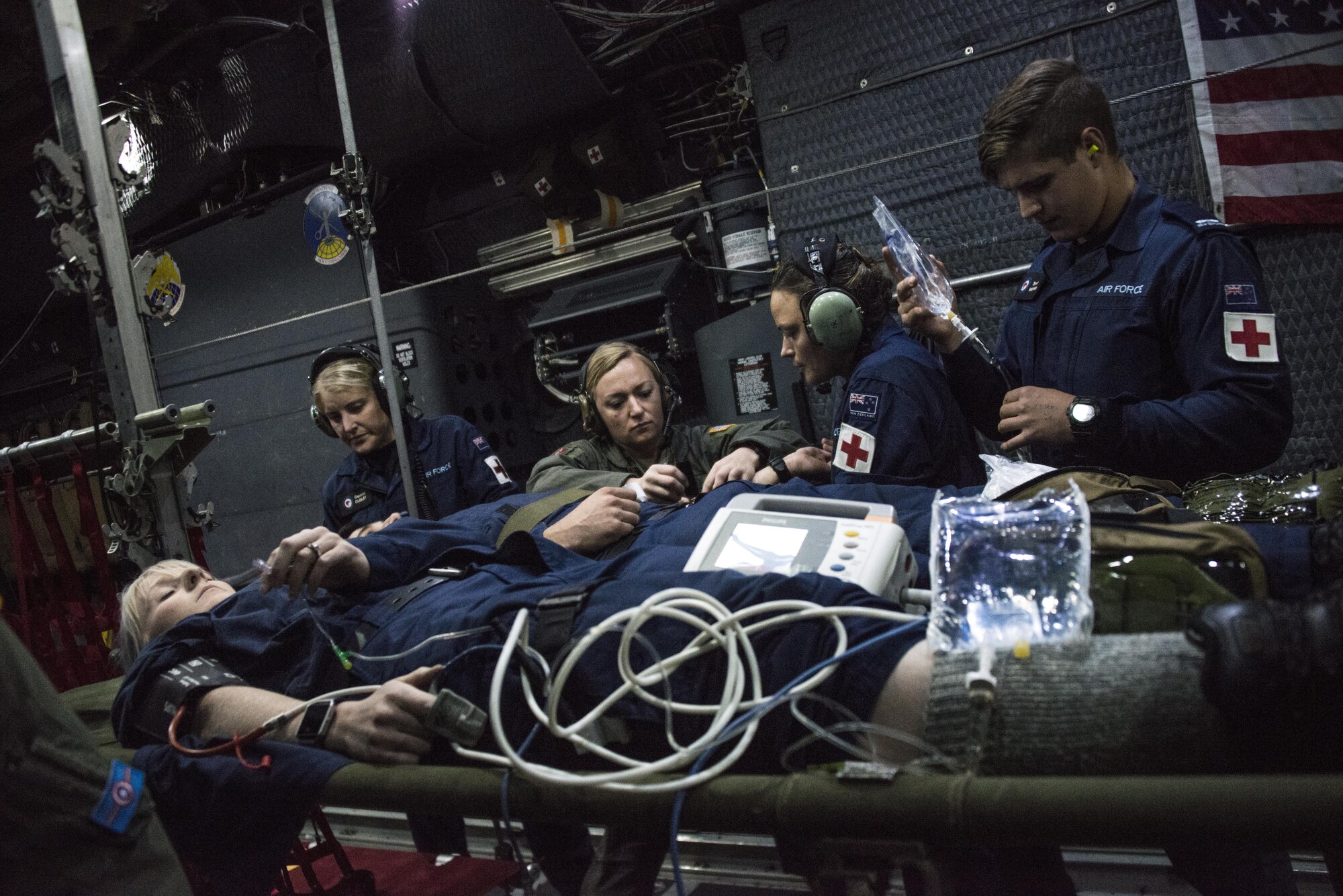 A U.S. Air Force Special Operations Forces Medical Element (SOFME) medic instructs a Royal New Zealand Air Force medic on how to set up litter during a casualty evacuation (CASEVAC) exercise, April 26, 2017 at RNZAF Base Woodbourne, New Zealand. Following 2-weeks of subject matter expert exchanges, the SOFME and RNZAF medics executed a CASEVAC from a U.S. Air Force MC-130H Combat Talon II assigned to the 1st Special Operations Squadron. (U.S. Air Force photo by Capt. Jessica Tait)
