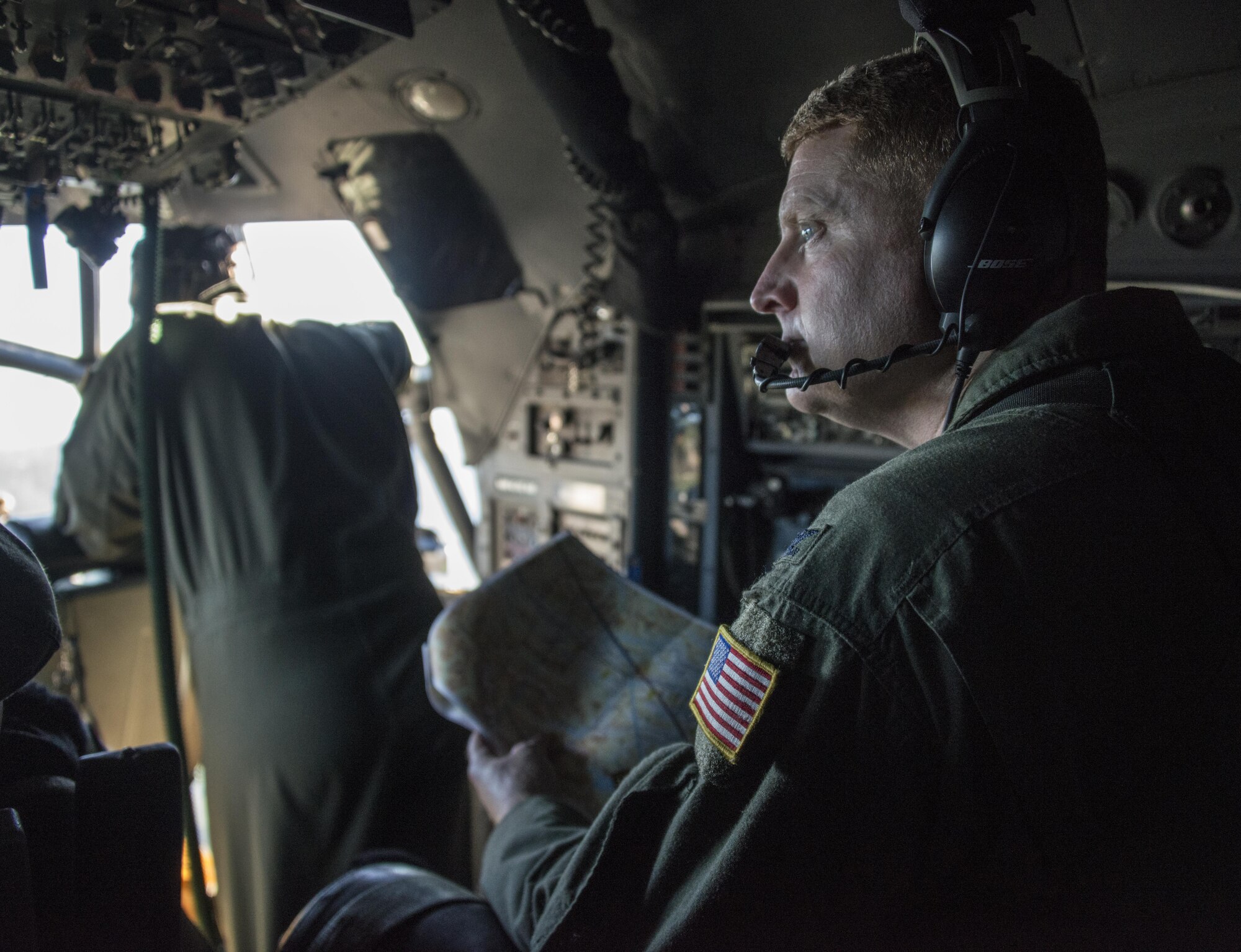 U.S. Air Force Col. William Freeman, 353rd Special Operations Group commander, performs electronic warfare officer duties during a formation flight with Royal New Zealand Air Force 40th Squadron, April 22, 2017 at RNZAF Base Woodbourne, New Zealand. Exercise Teak Net provided the opportunity at further developing interoperability with counterparts from the RNZAF through daily airborne operations to include low-level formation work and tactical operations on night vision goggles. (U.S. Air Force photo by Capt. Jessica Tait)