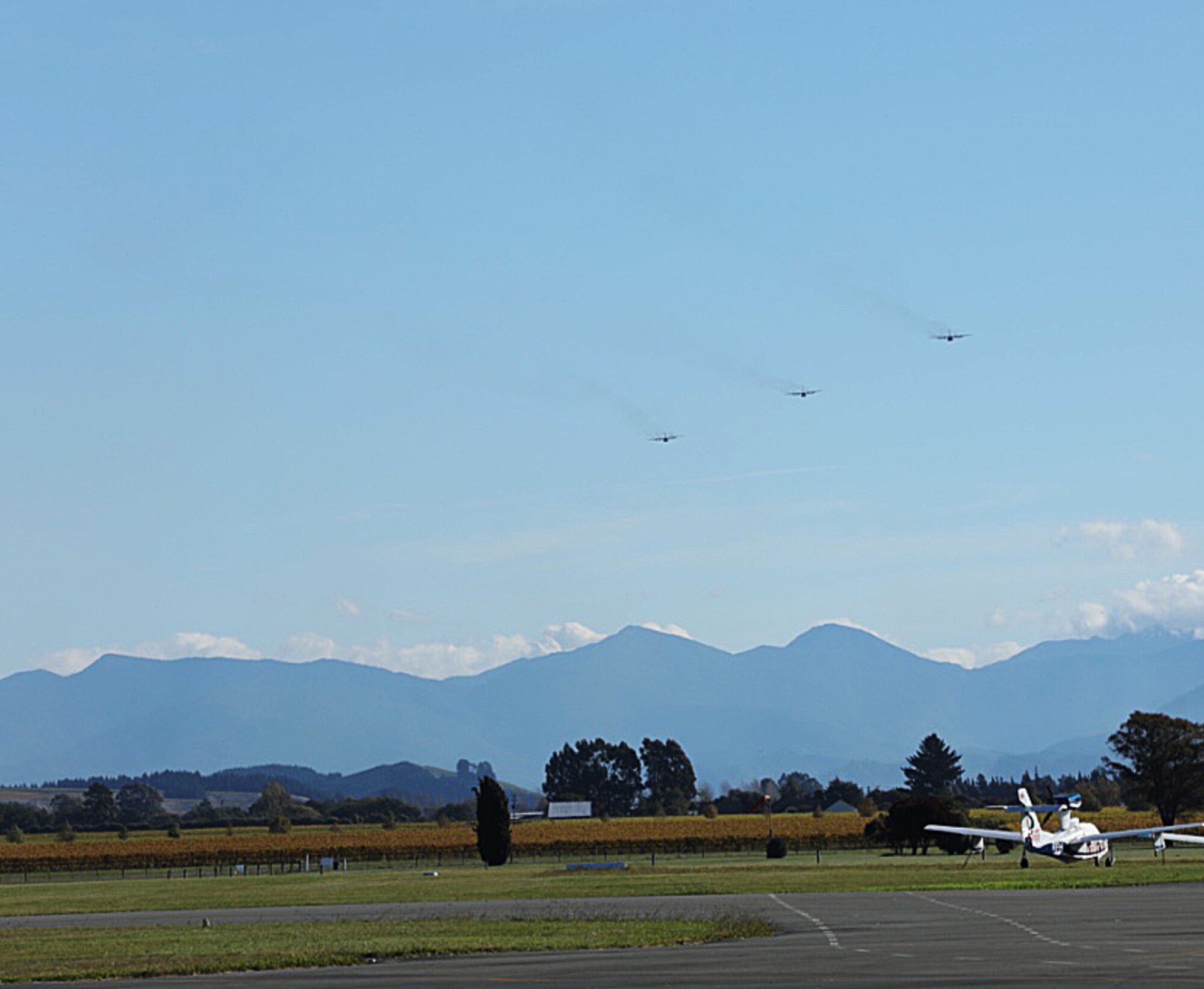 Two U.S. Air Force 1st Special Operations Squadron MC-130H Combat Talon II fly in formation with a Royal New Zealand Air Force 40th Squadron C-130, April 27, 2017 at RNZAF Base Woodbourne, New Zealand. The combined mission demonstrated the strength of the alliance between the United States and New Zealand. (U.S. Air Force photo by Capt. Jessica Tait)