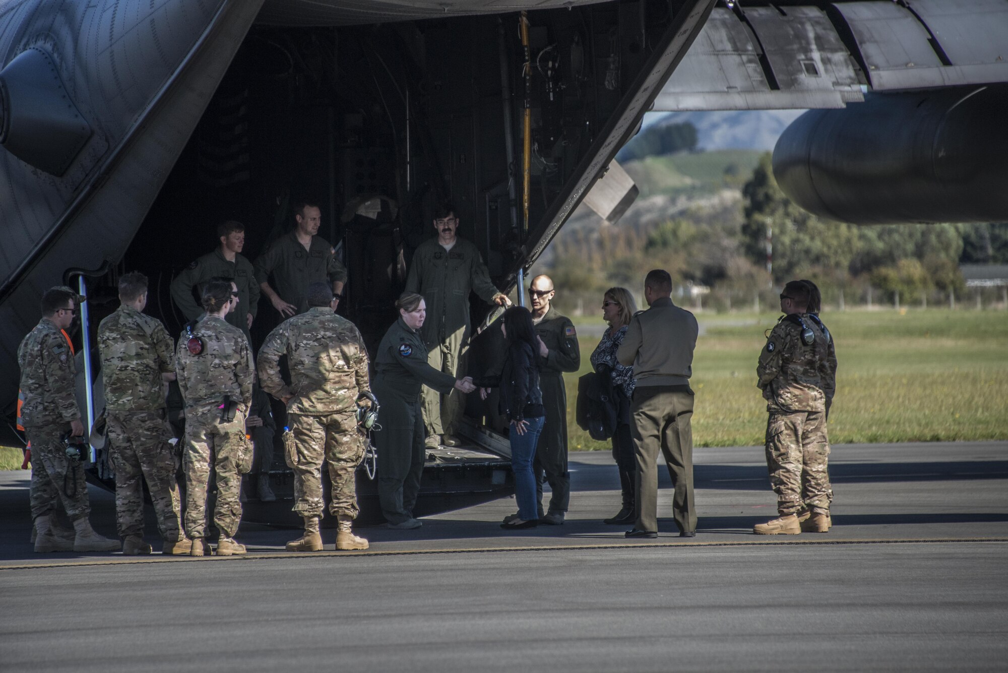 U.S. Air Force 353rd Special Operations Group aircrew and maintenance personnel greet staffers from the U.S. Embassy New Zealand during a visit, April 19, 2017 at Royal New Zealand Air Force Base Woodbourne, New Zealand. The air commandos provided observation flights on their MC-130H Combat Talon II and opportunities to engage with aircrew, maintenance and support personnel during the visit. (U.S. Air Force photo by Capt. Jessica Tait)