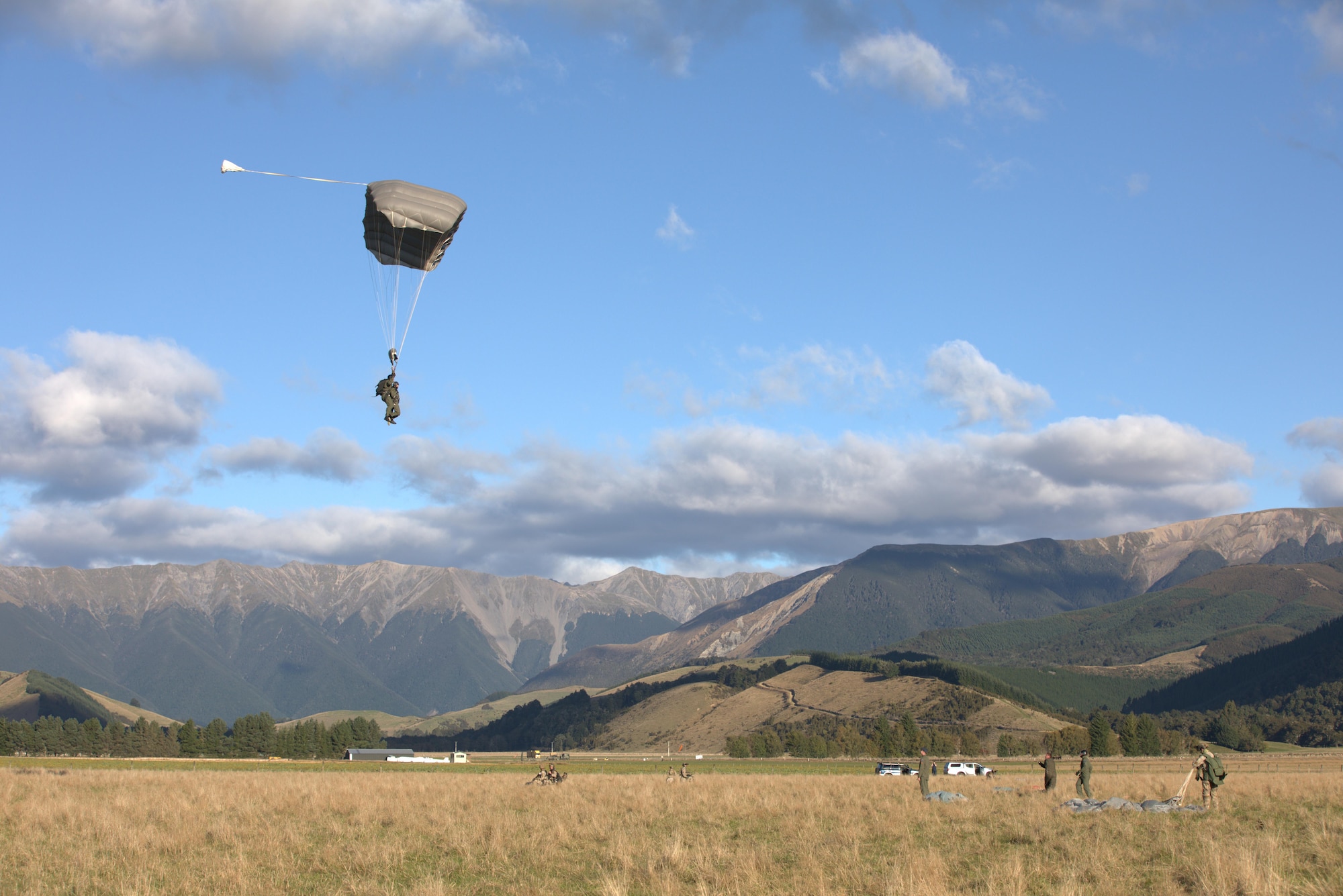 Ms. Candy Green, U.S. Embassy New Zealand’s Chargé d'Affaires, jumps from a Royal New Zealand Air Force C-130 during a tandum parachute jump, April 20, 2017 at RNZAF Base Woodbourne, New Zealand. Members of the 353rd Special Operations Group and RNZAF 40th Squadron showcased the military cooperation efforts between the U.S. and New Zealand militaries during a U.S. Embassy visit. (U.S. Air Force photo by Capt. Jessica Tait)