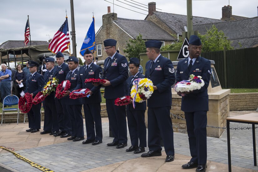 Members of the 305th Air Mobility Wing at Joint Base McGuire-Dix-Lakehurst, New Jersey, prepare to lay wreaths during the 10th annual rededication ceremony for the 305th Bombardment Group in Chelveston, England, on May 27. 20 members of the 305th AMW took part in the ceremony. (U.S. Air Fore photo by Senior Airman Joshua King)