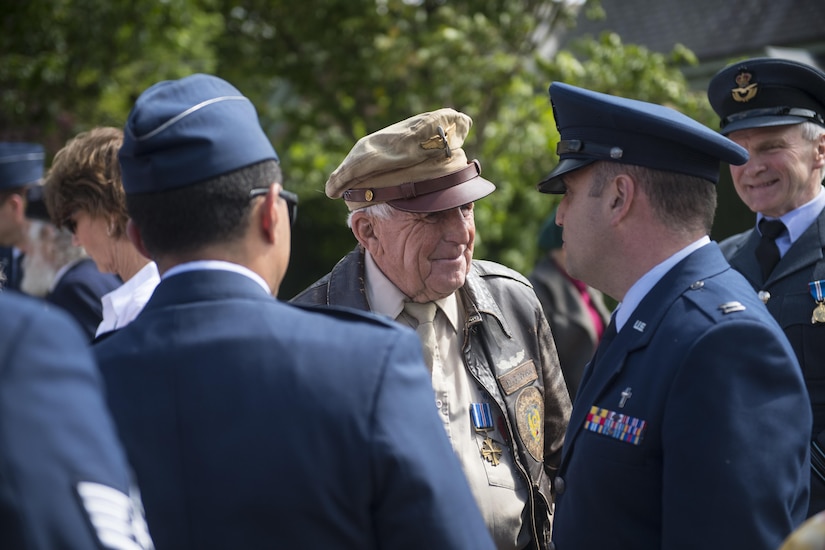 Douglas Ward, 305th Bombardment Group veteran, speaks to Airmen of the 305th Air Mobility Wing at a rededication ceremony for the 305th BG memorial in Chelveston, England on May 27. The 305th Bombardment Group, flying the B-17 Flying Fortress, flew 480 combat missions over occupied Europe during World War II as part of the 1st Division of the 8th Air Force. (U.S. Air Force photo by Senior Airman Joshua King.)