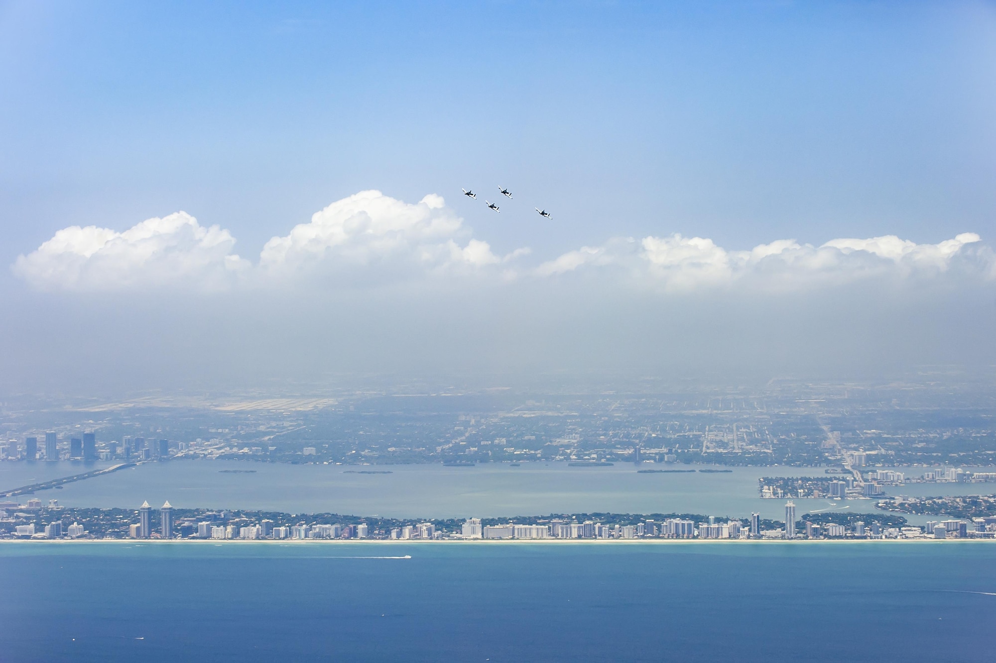 Four A-10 Thunderbolt II from the 442d Fighter Wing, out of Whiteman, Mo., fly over Miami Beach during the National Salute to America’s Heroes Air and Sea Show media day May 26, 2017, at Miami Beach, Fla. Top tier U.S. military assets have assembled in Miami to showcase air superiority while honoring those who have made the ultimate sacrifice during the Memorial Day weekend. The 442d FW will team up with two HH-60G Pave Hawk and an HC-130P/N Combat King aircraft from the 920th Rescue Wing and the 129th Rescue Wing respectively, to headline the airshow by demonstrating combat-search-and-rescue capabilities. (U.S. Air Force photo/Staff Sgt. Jared Trimarchi)