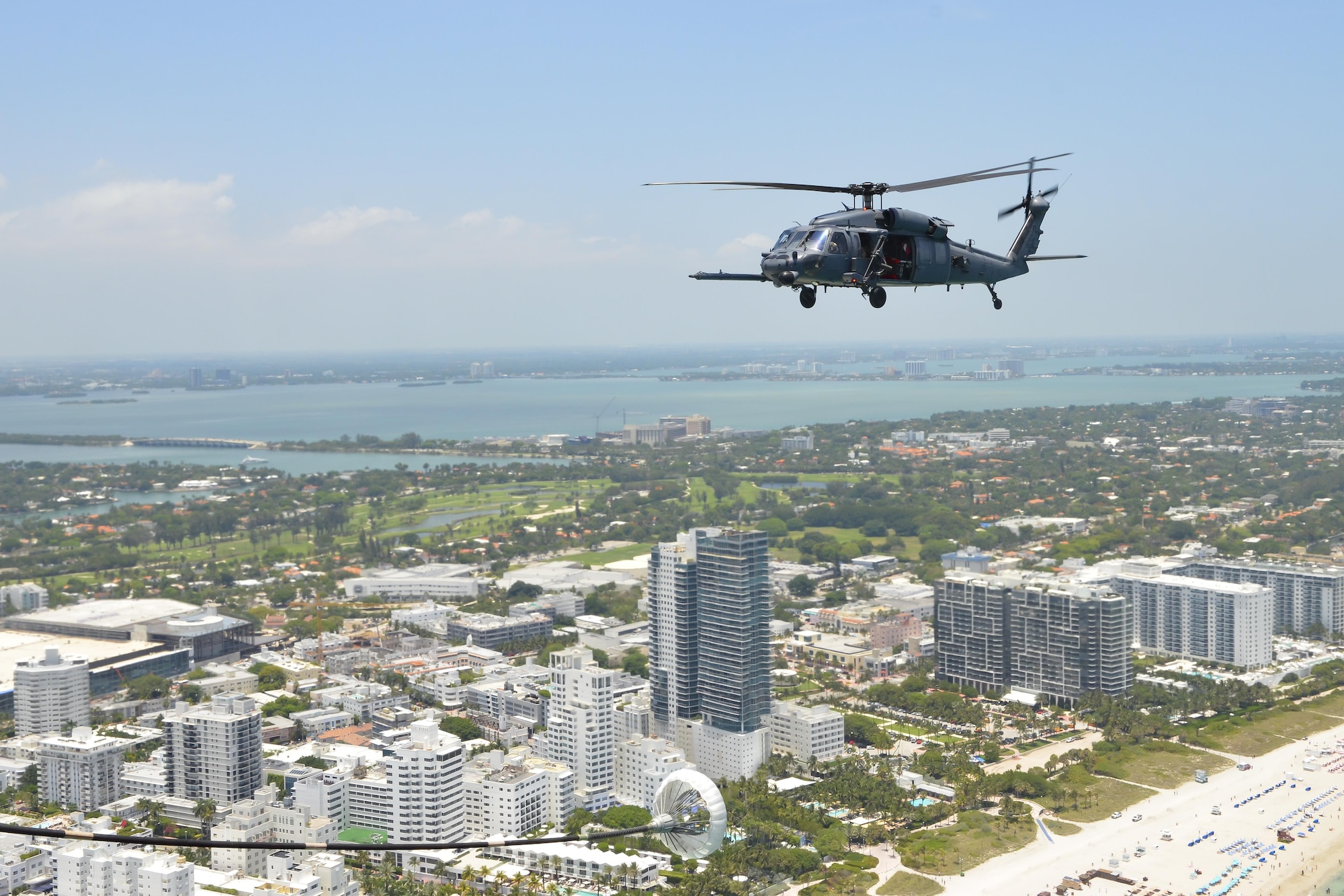 Aircrew from the 920th Rescue Wing out of Patrick Air Force Base, Fla., fly an HH-60G Pave Hawk helicopter during the National Salute to America’s Heroes Air and Sea Show, May 26, 2017, at Miami Beach, Fla. Top tier U.S. military assets assembled in Miami to showcase air superiority while honoring those who have made the ultimate sacrifice during the Memorial Day weekend. The 920th Rescue Wing, the Air Force Reserve’s only rescue wing, headlined the airshow, demonstrating combat-search-and-rescue capabilities, by teaming up with a HC-130P/N Combat King and four A-10 Thunderbolt II aircraft. (U.S. Air Force photo/Senior Airman Brandon Kalloo Sanes)