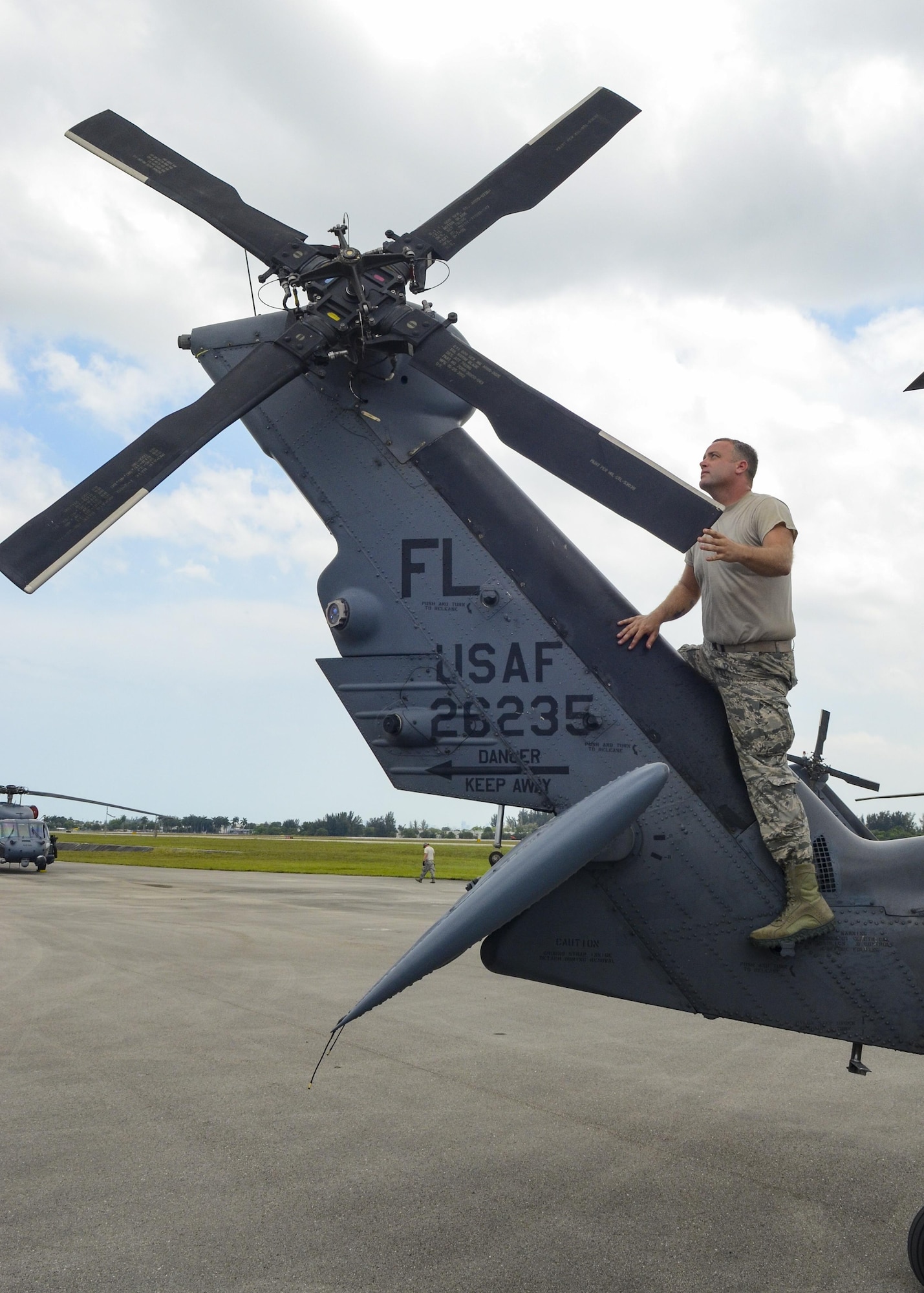 Staff Sgt. Nathan Weiss, crew chief from the 920th Rescue Wing, works on an HH-60G Pave Hawk helicopter near Miami Beach during the National Salute to America’s Heroes Air and Sea Show media day May 26, 2017. Top tier U.S. military assets have assembled in Miami to showcase air superiority while honoring those who have made the ultimate sacrifice during the Memorial Day weekend. The 920th Rescue Wing, the Air Force Reserve’s only rescue wing, will headline the airshow by demonstrating combat-search-and-rescue capabilities by teaming up with a HC-130P/N Combat King and four A-10 Thunderbolt II aircraft. (U.S. Air Force photo by Senior Airman Brandon Kalloo Sanes)