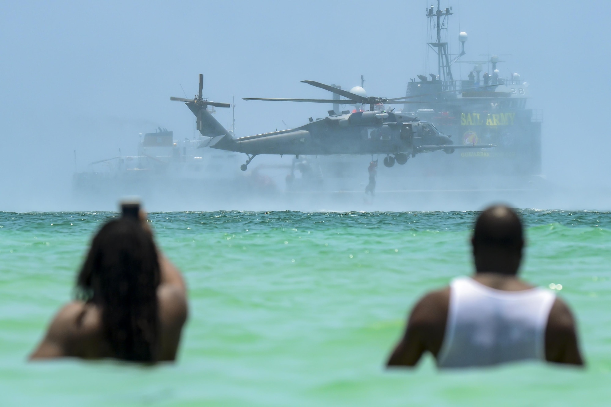 Spectators view an aerial demonstration during the National Salute to America’s Heroes Air and Sea Show, May 28, 2017, at Miami Beach, Fla. Top tier U.S. military assets assembled in Miami to showcase air superiority while honoring those who have made the ultimate sacrifice during the Memorial Day weekend. (U.S. Air Force photo/Senior Airman Brandon Kalloo Sanes)