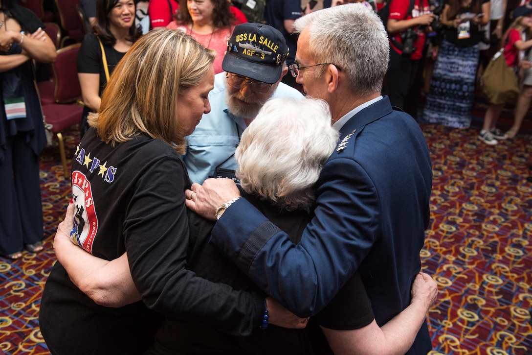 Ms. Bonnie Carroll, TAPS President and Founder, left, and Air Force Gen. Paul J. Selva, vice chairman of the Joint Chiefs of Staff, embrace the mother and father of U.S. Navy Electronics Technician 1st Class Ronald Hemenway after the Tragedy Assistance Program for Survivors Grand Banquet at the 23rd TAPS National Military Survivor Seminar and Good Grief Camp in Arlington, Va., May 27, 2017. Hemenway died at the Pentagon during the 9/11 terrorist attacks. DoD Photo by Army Sgt. James K. McCann