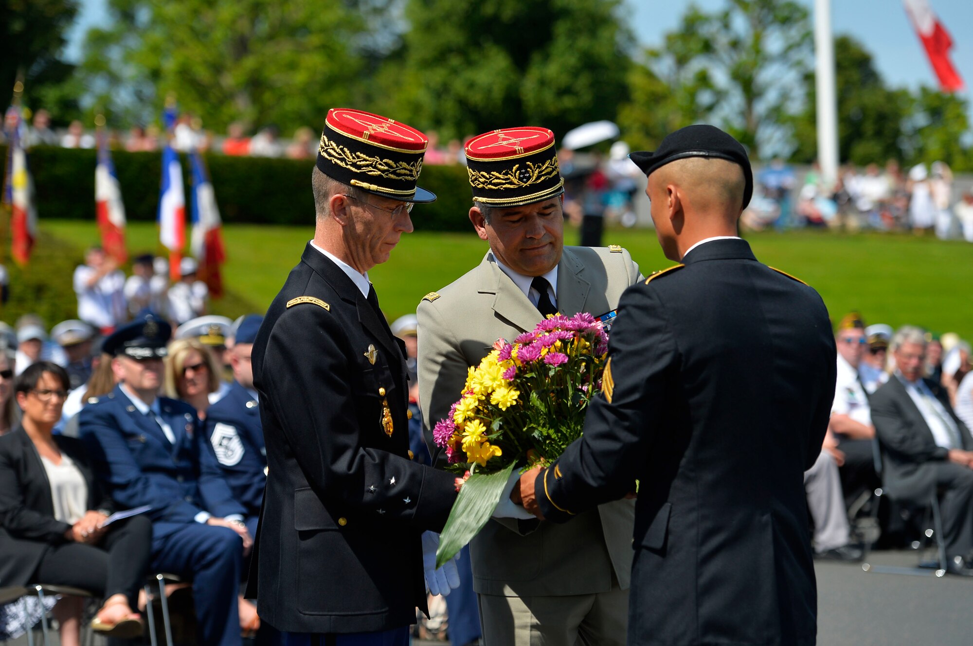 French military officials receive a wreath from a U.S. Army representative during a Memorial Day ceremony on Lorraine American Cemetery and Memorial, France, May 28, 2017. 2017’s ceremony was especially notable, because it marked 100 years since the U.S. entered the First World War. (U.S. Air Force photo by Airman 1st Class Joshua Magbanua)

