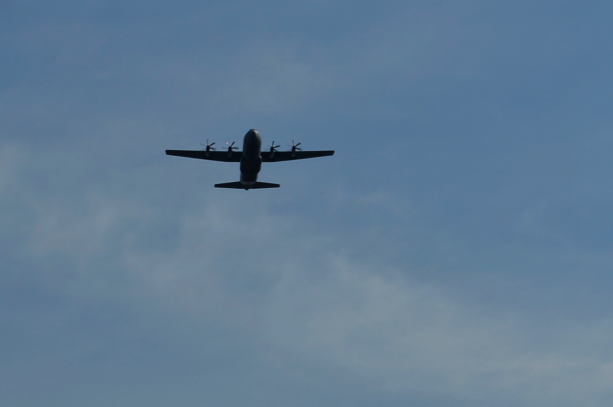 A C-130J Super Hercules flies over Lorraine American Cemetery and Memorial, France, May 28, 2017. The fly-over occurred during an annual Memorial Day ceremony shortly after the U.S. and French anthems were played. (U.S. Air Force photo by Airman 1st Class Joshua Magbanua)

