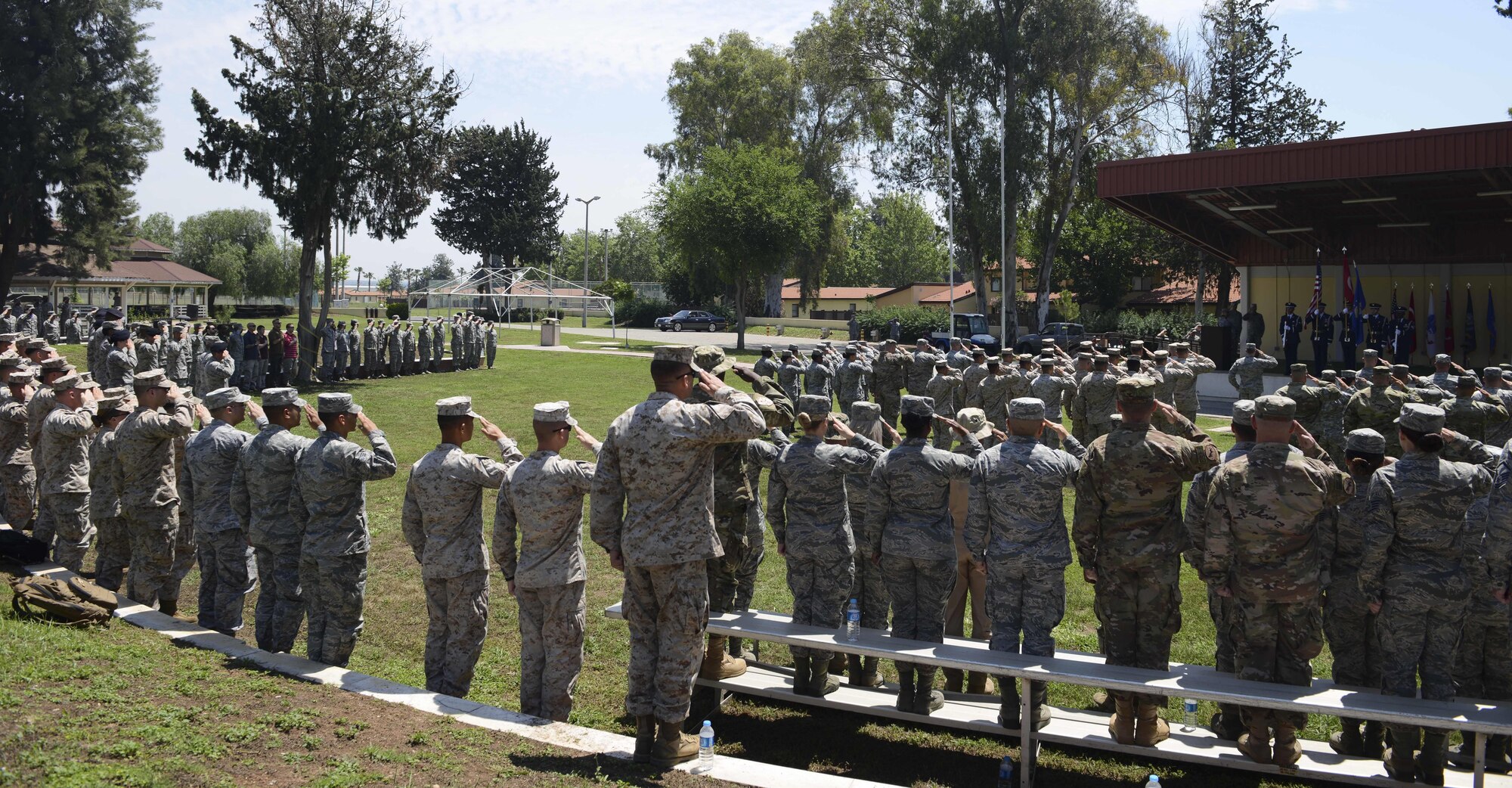 Members assigned to the 39th Air Base Wing, salute the colors during a Memorial Day Ceremony May 26, 2017, at Incirlik Air Base, Turkey. Memorial Day honors the men and women who paid the ultimate sacrifice serving in the United States military. This marked the first joint service ceremony at Incirlik. (U.S. Air Force photo by Airman 1st Class Devin M. Rumbaugh)