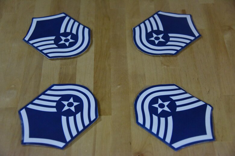 Master sergeant stripe decorations lie on a table during a master sergeant release party held at an undisclosed location in Southwest Asia, May 24, 2017. The 386th Air Expeditionary Wing Top Three Council hosted a master sergeant release party to celebrate the five technical sergeants that were selected for master sergeant.  (U.S. Air Force photo/Tech. Sgt. Jonathan Hehnly)